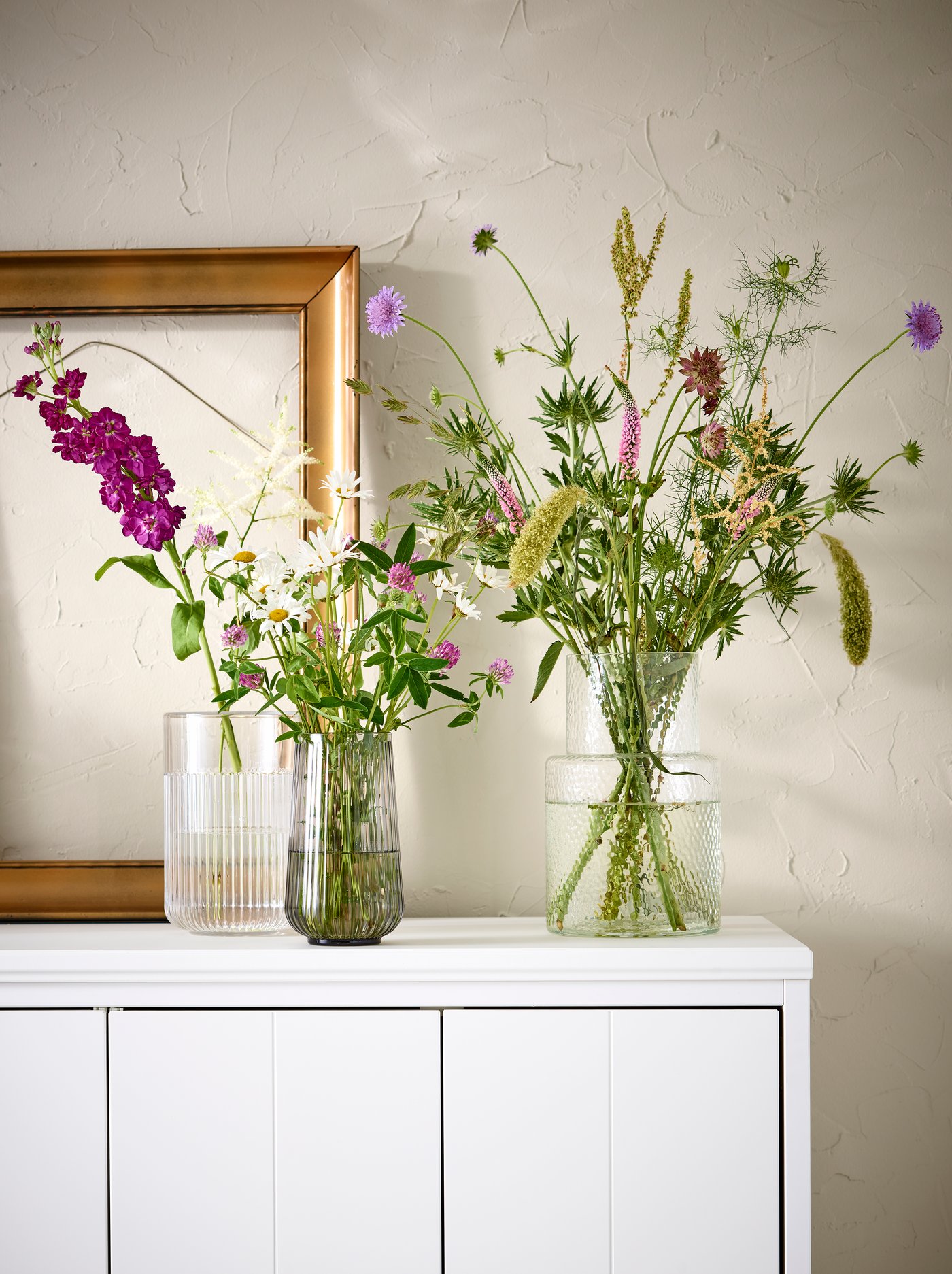A clear glass/patterned KONSTFULL vase