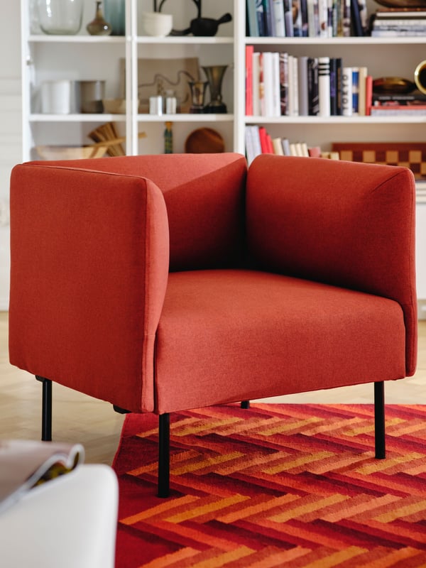 A Gunnared/brown-red wood LILLEHEM armchair in the living room