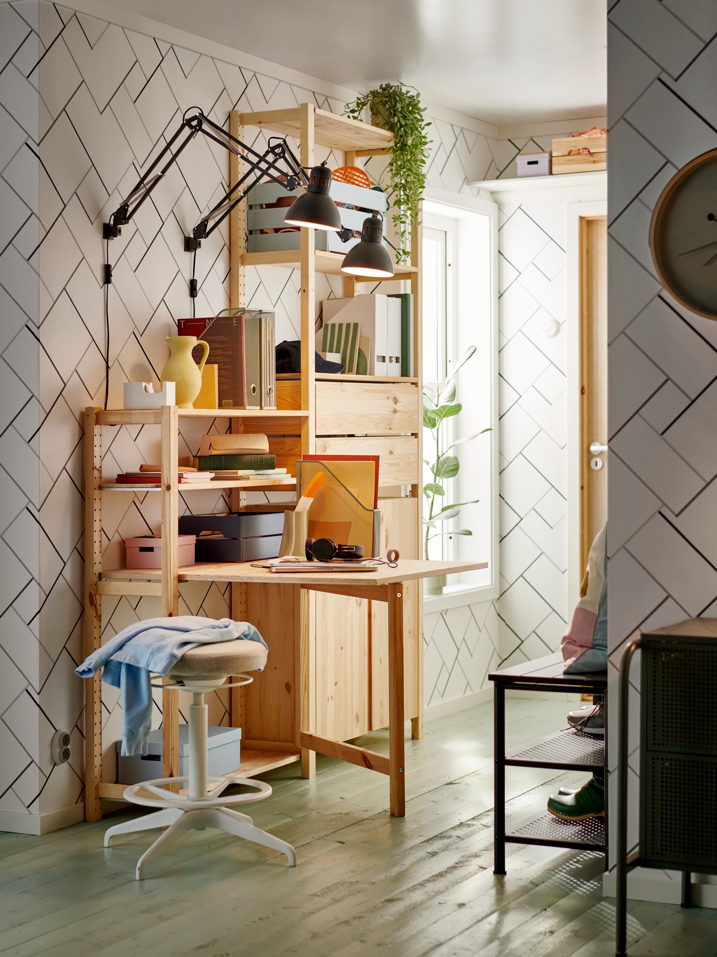 A dark grey TERTIAL work lamp in the home office