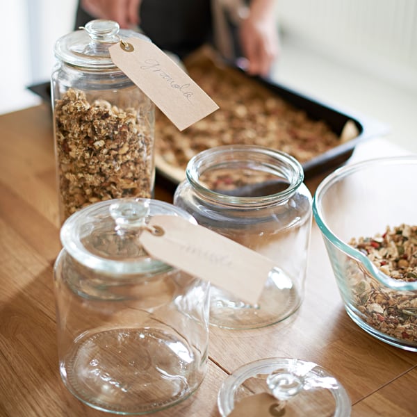 A clear glass VARDAGEN jar with lid