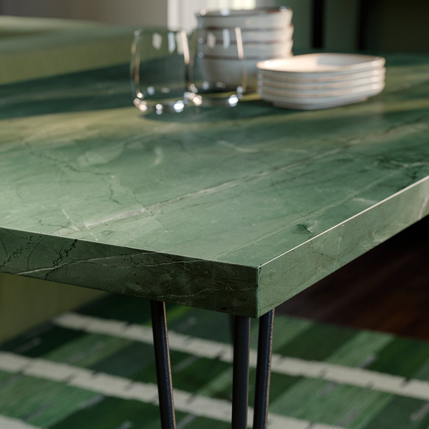 Close up of a dark grey-green marble effect/hairpin black-grey SKÅLSTA table.