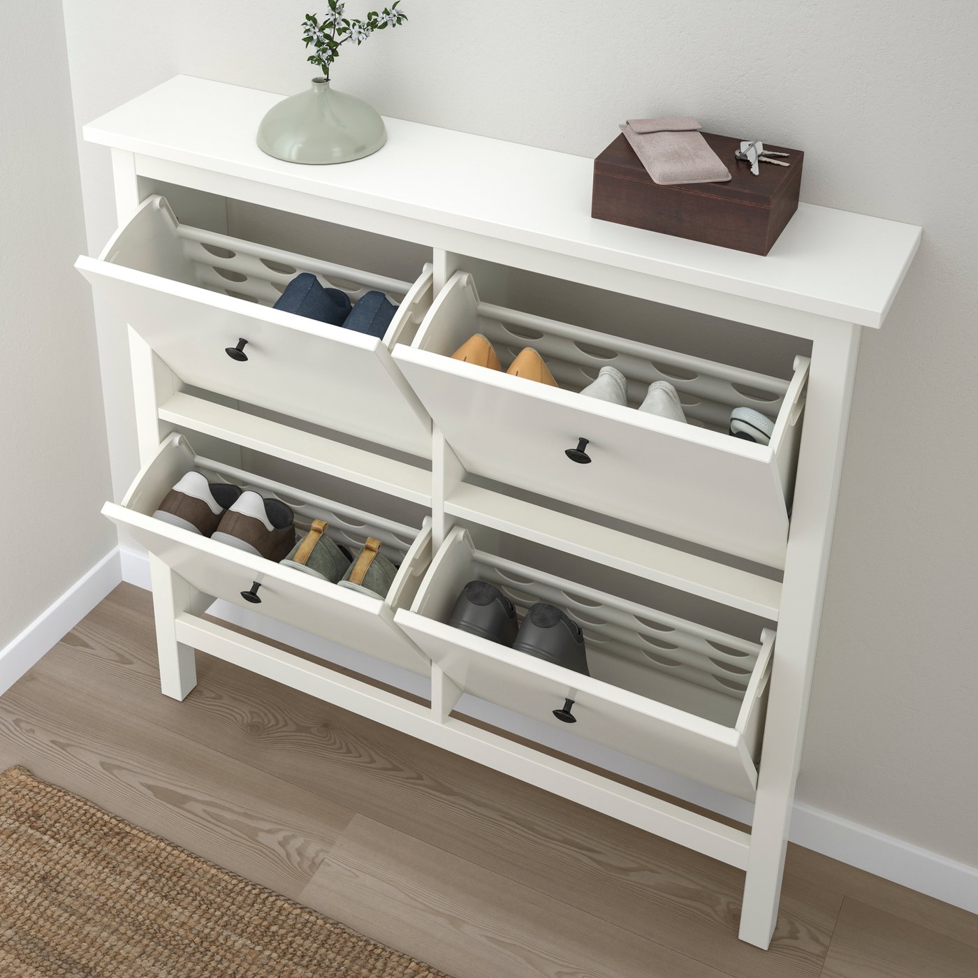 A white HEMNES shoe cabinet with 4 compartments