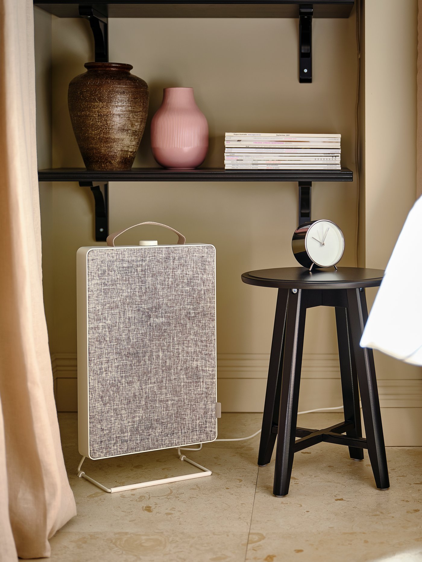 A white FÖRNUFTIG air purifier in the bedroom