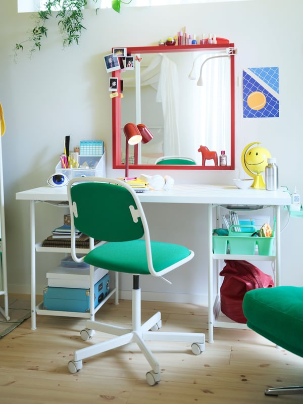 A white/Vissle green ÖRFJÄLL swivel chair in the childrens room