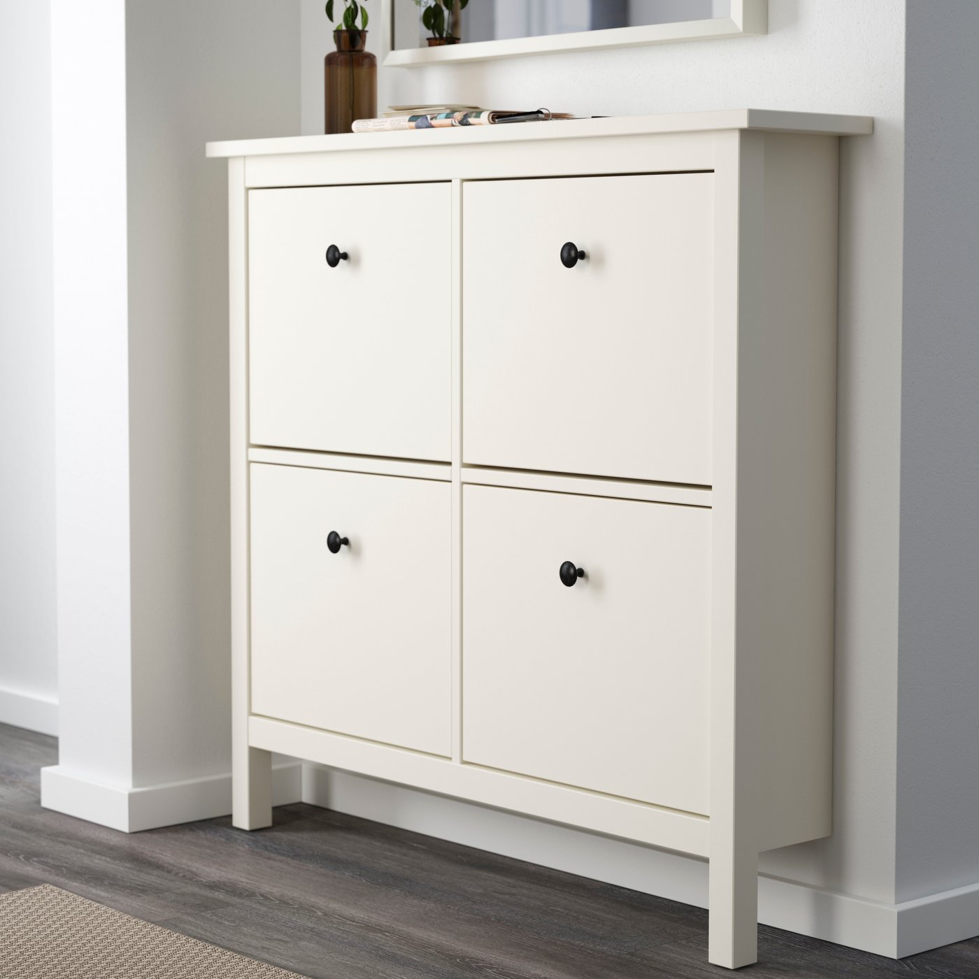 A white HEMNES shoe cabinet with 4 compartments