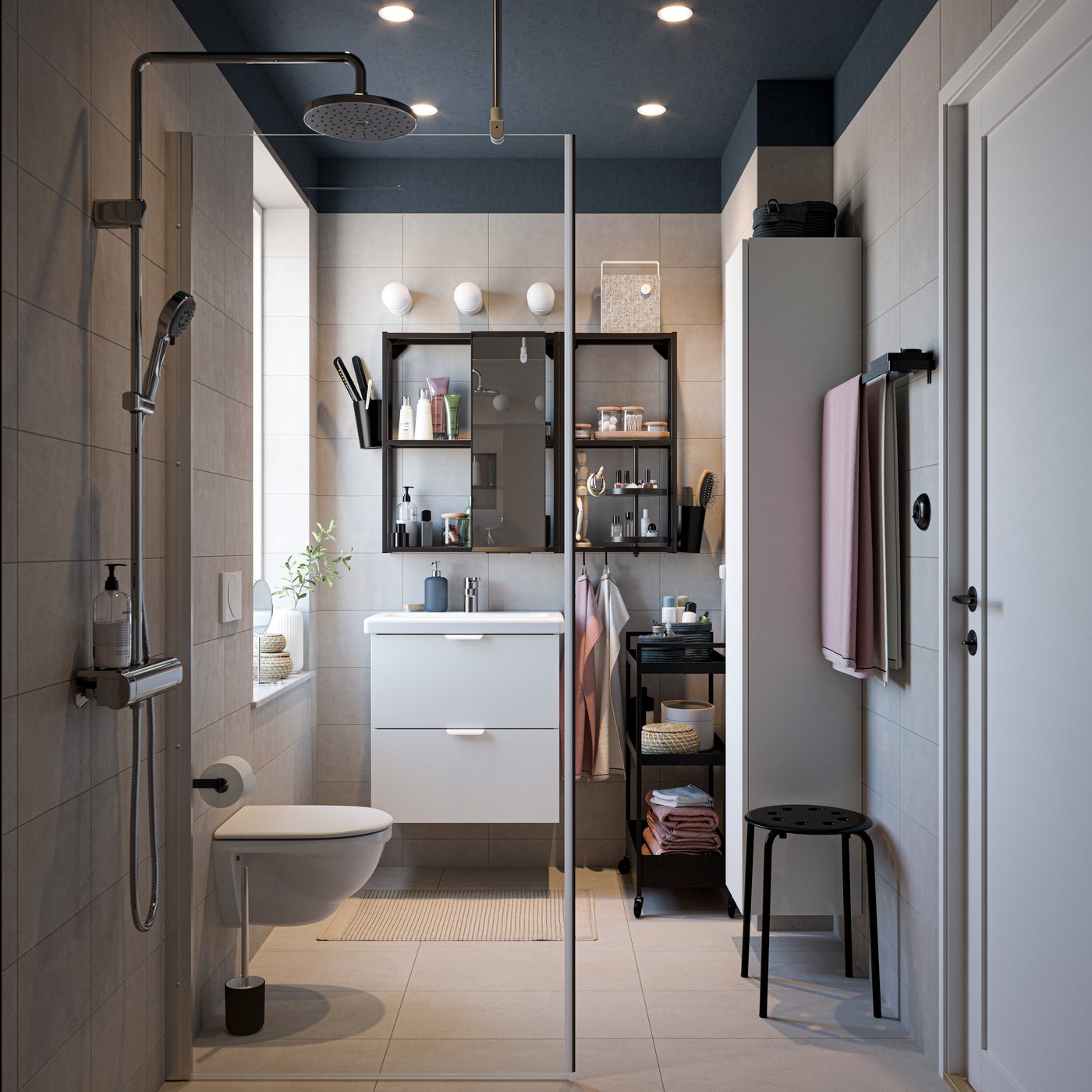 A black MARIUS stool in the bathroom