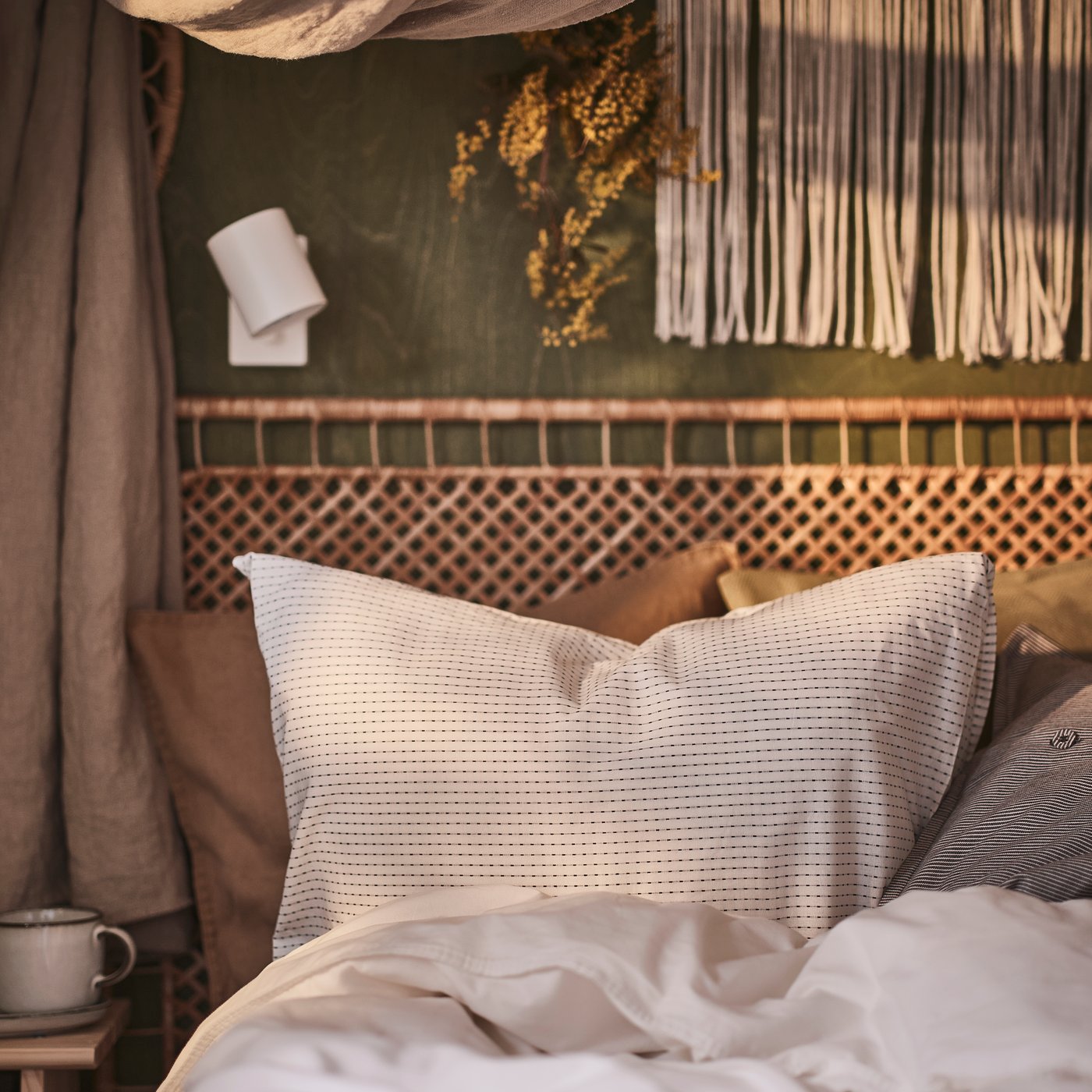 A handmade rattan TOLKNING headboard