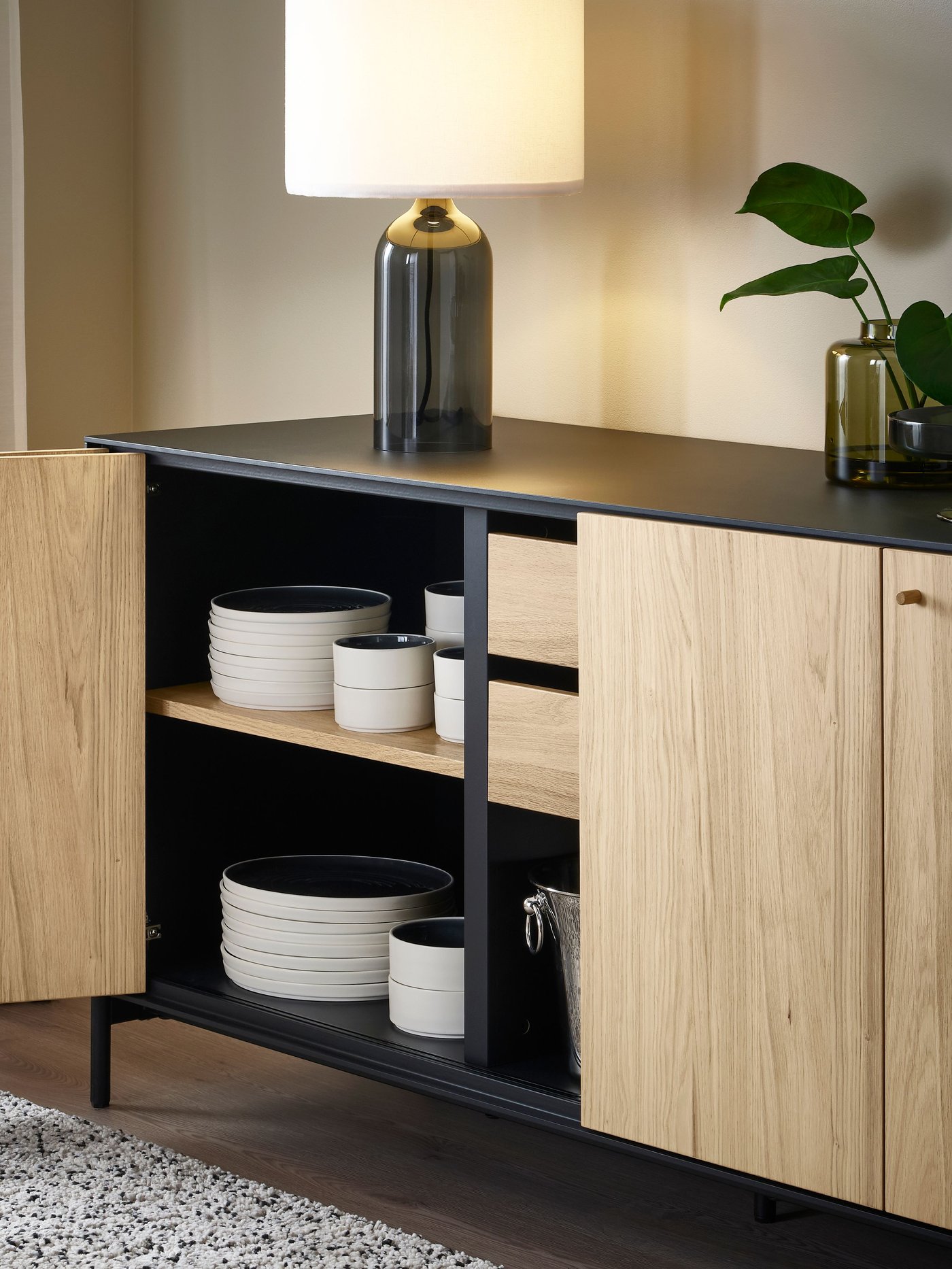 A black/oak veneer BOASTAD sideboard