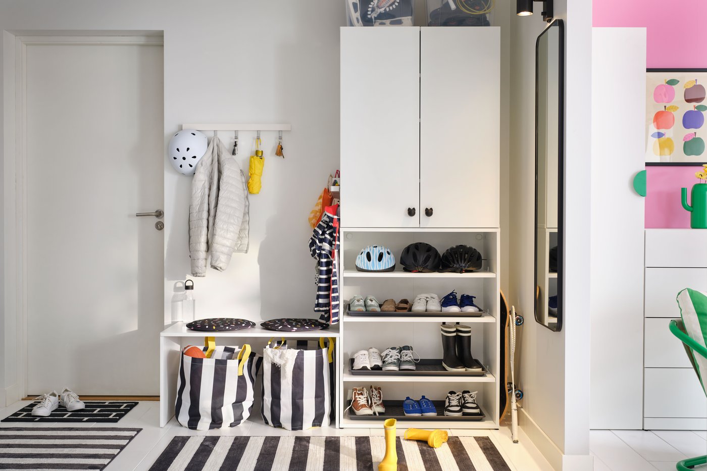 A black/white/stripe ELSYSTEM rug, low pile in the hallway