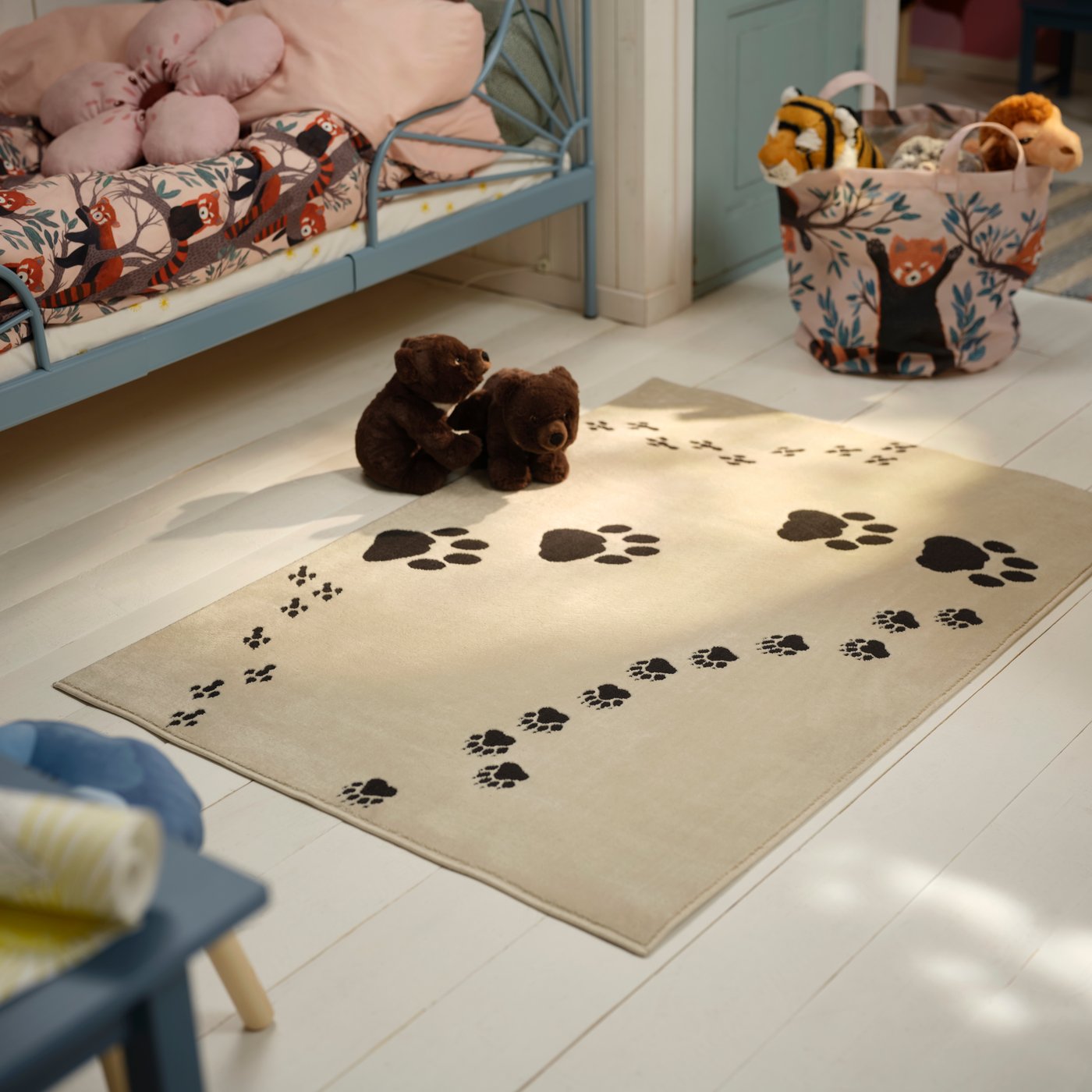 An Asiatic black bear cub ALPTALL soft toy in the childrens room