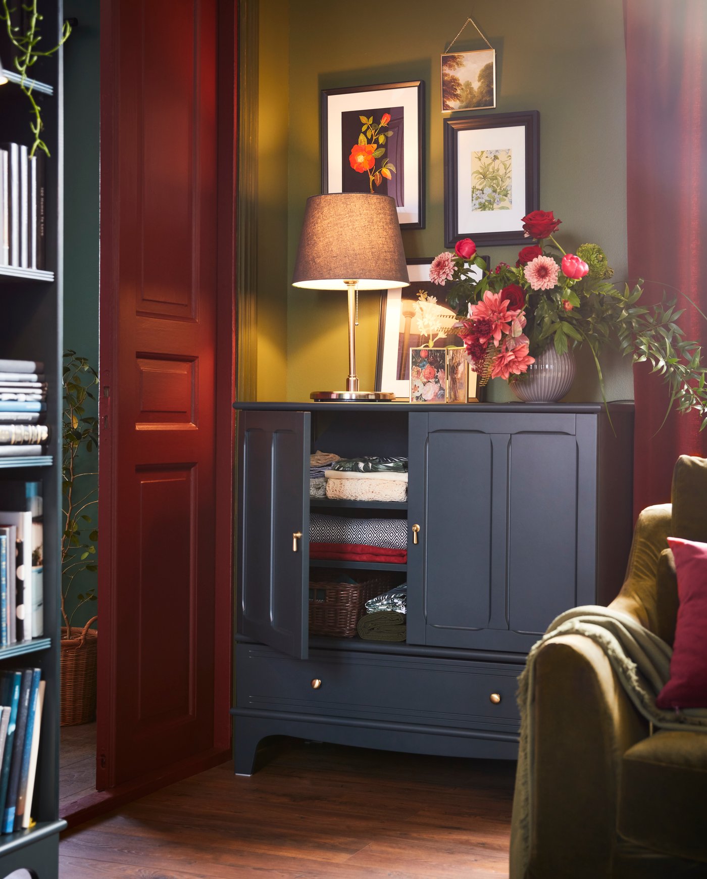 A dark blue-green LOMMARP cabinet in the living room