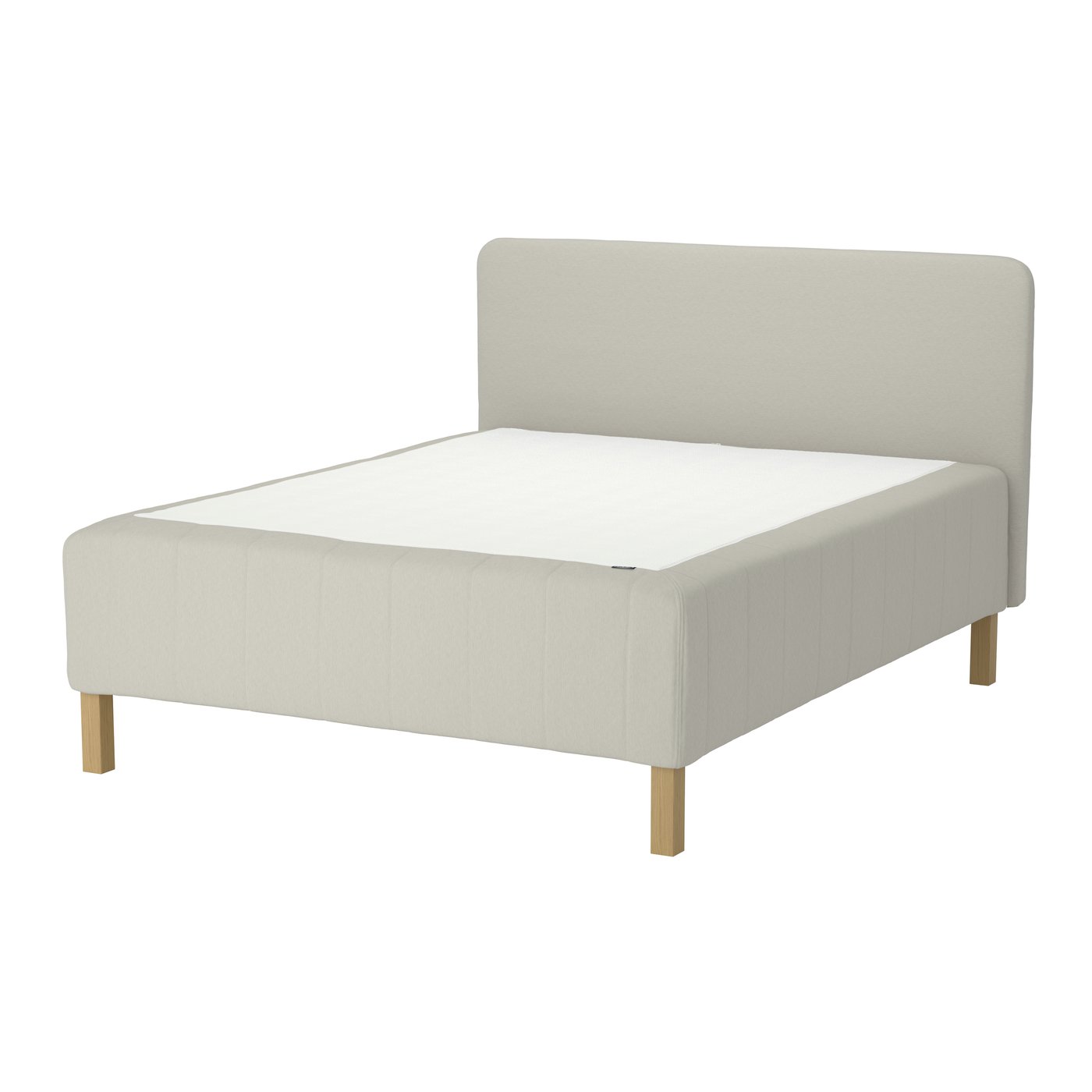 A beige RÅHOLMAR spring base bed with a headboard.