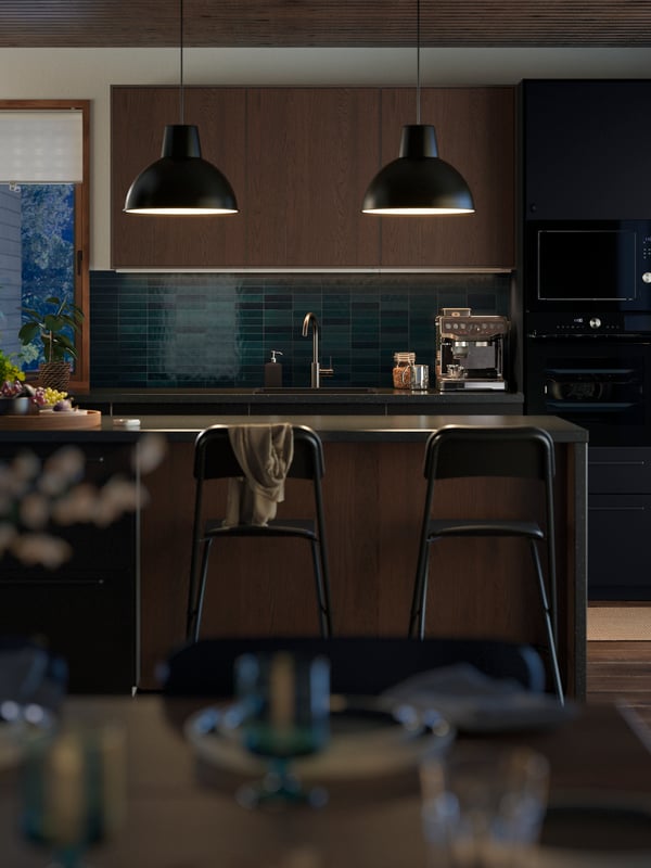 A black mineral effect/laminate SÄLJAN custom made worktop in the kitchen