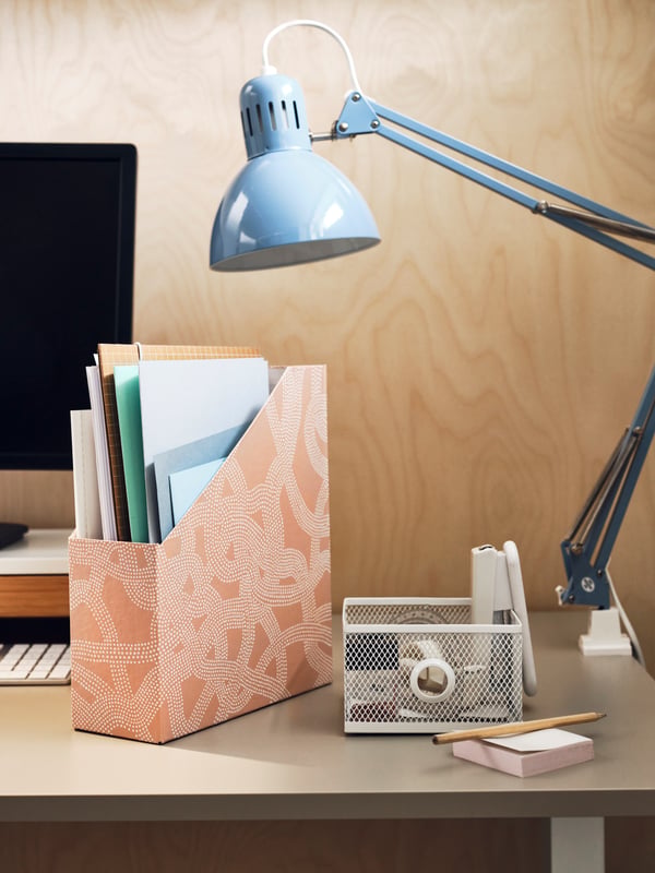 A desk with a desk lamp