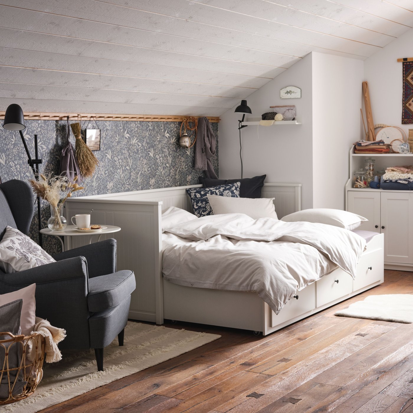 A black SKURUP floor/reading lamp in the bedroom