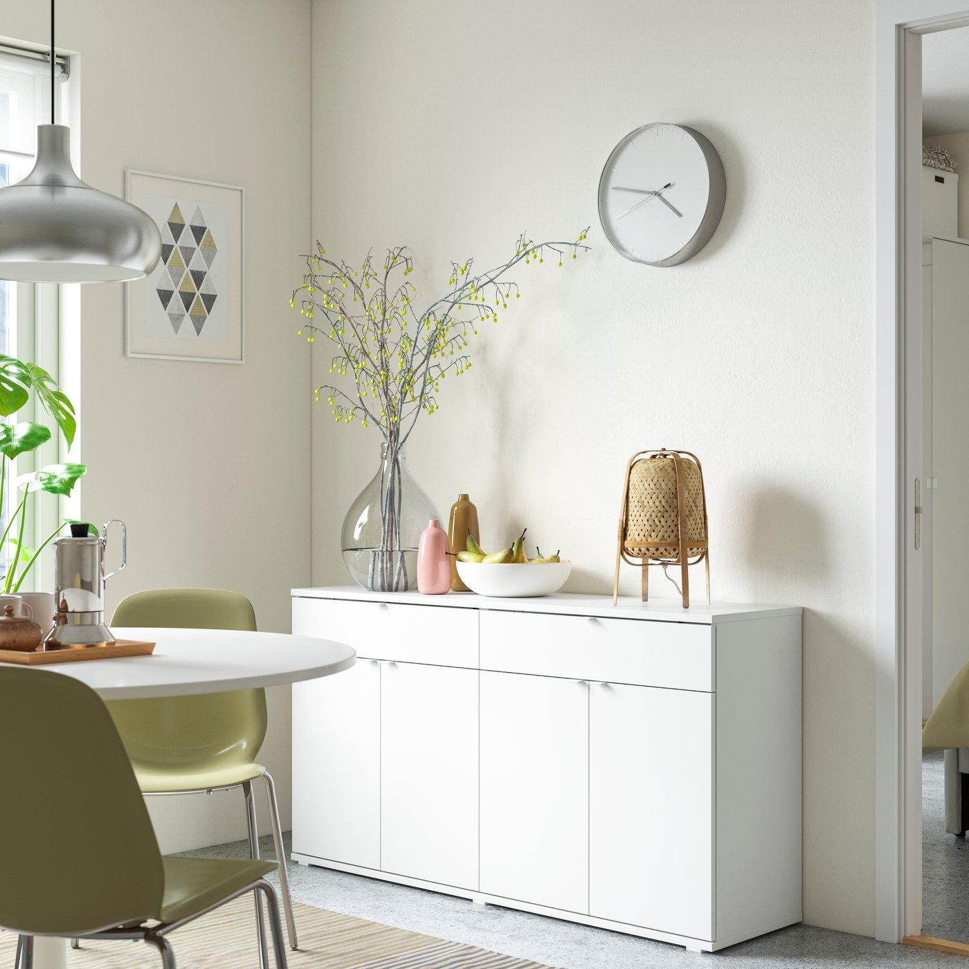 A white VIHALS sideboard in the dining room