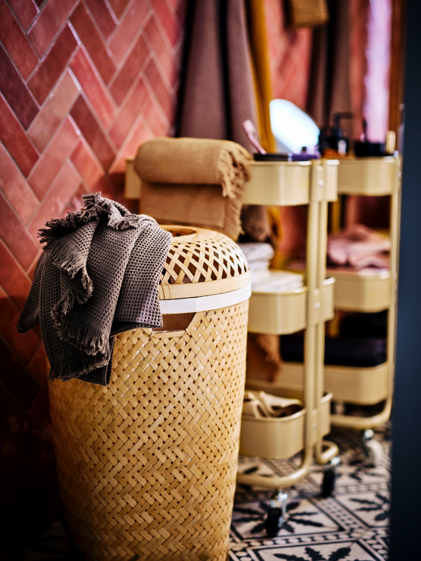 A handmade bamboo SALUDING laundry basket in the bathroom