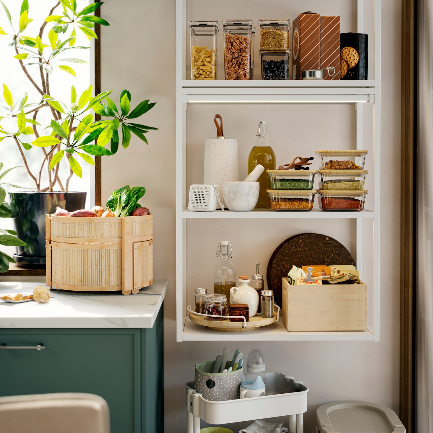 An ENHET wall frame is mounted on a kitchen wall and there’s a basket made of bamboo on the kitchen worktop next to it.