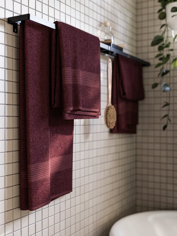 A deep red FREDRIKSJÖN hand towel