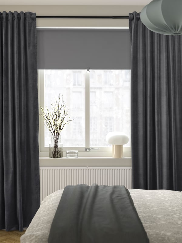 A light grey TRETUR block-out roller blind