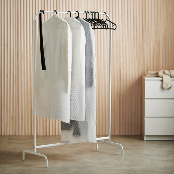 A black SPRUTTIG hanger in the bedroom