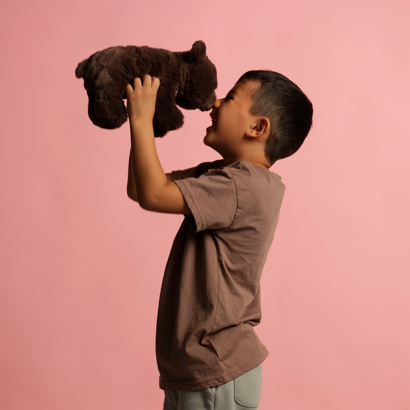 An Asiatic black bear cub ALPTALL soft toy in the childrens room