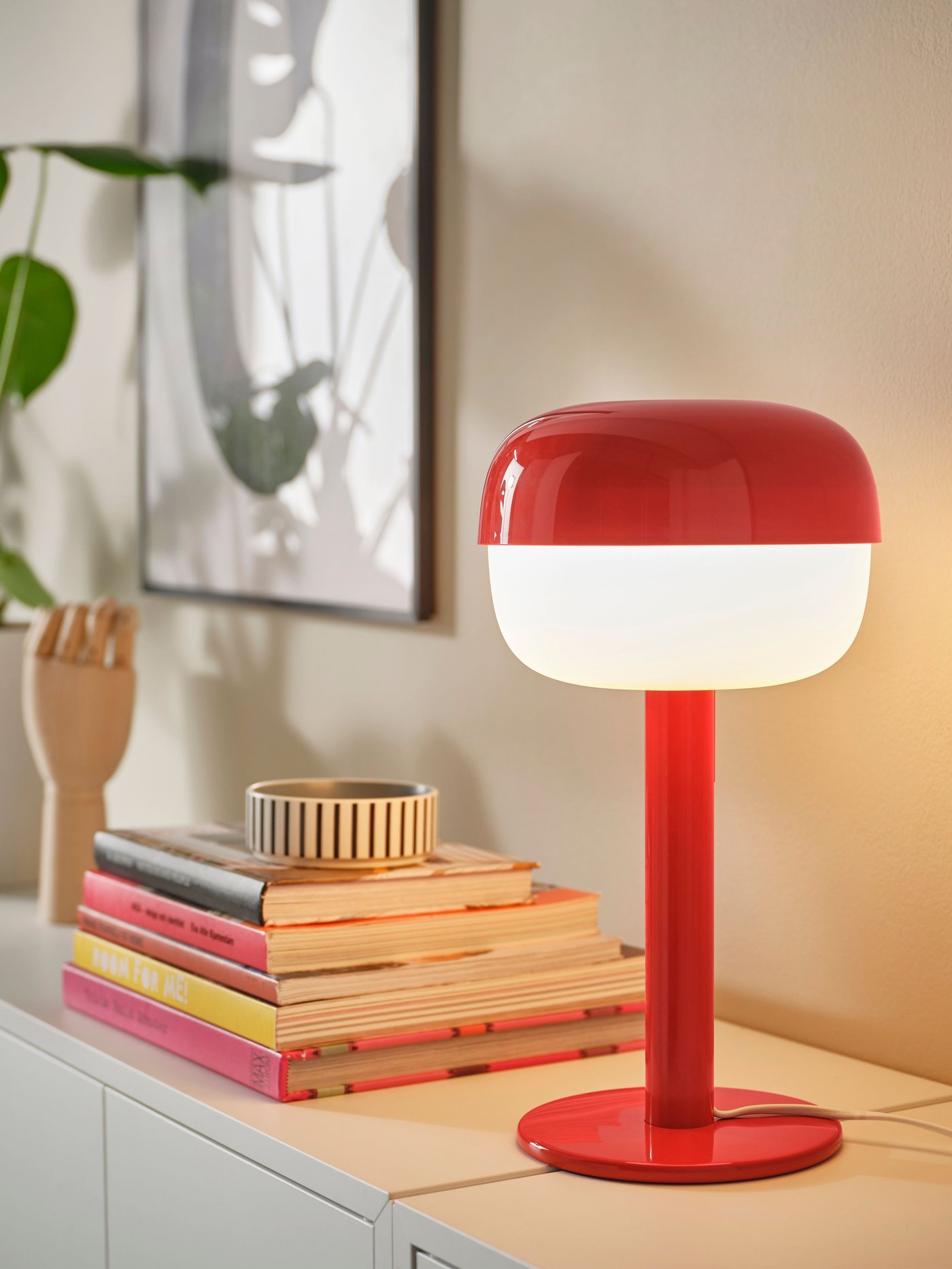 A red BLÅSVERK table lamp