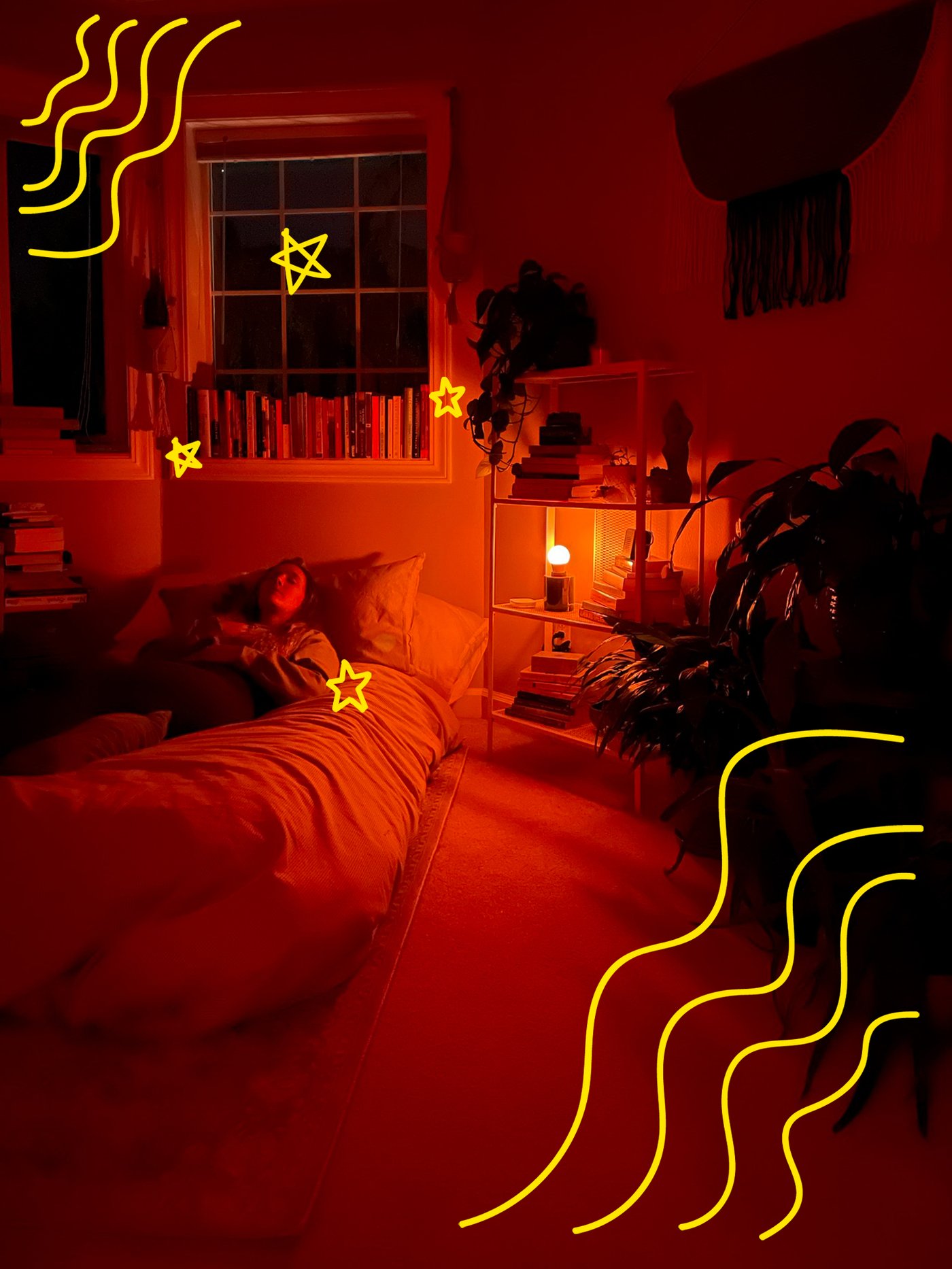 A woman lying on her bed, meditating, in a room illuminated by a red-coloured light.