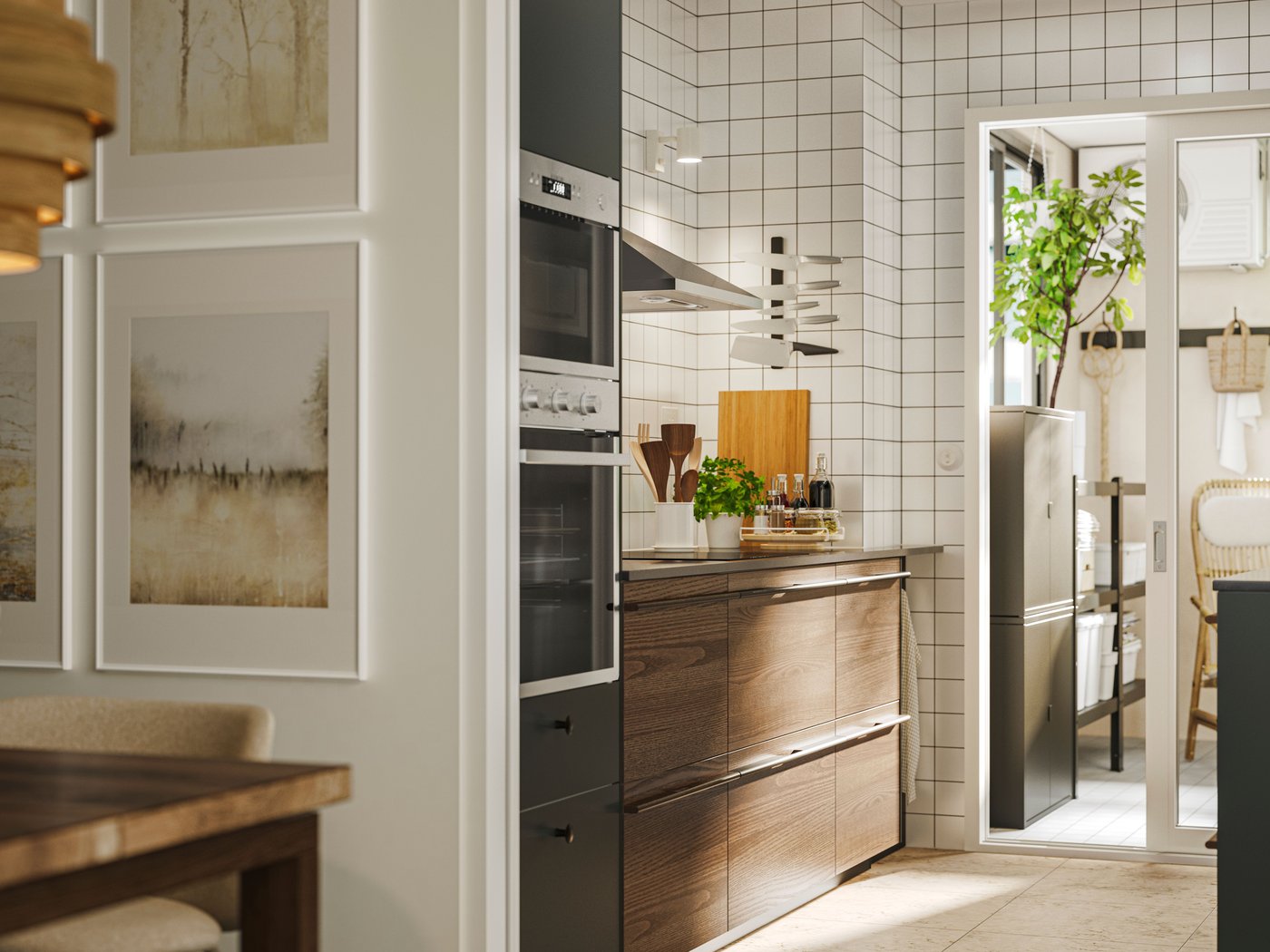 Kitchen with STENSTA dark brown ash veneer fronts, white tiled backsplash, and a view into a pantry with plants and a chair.