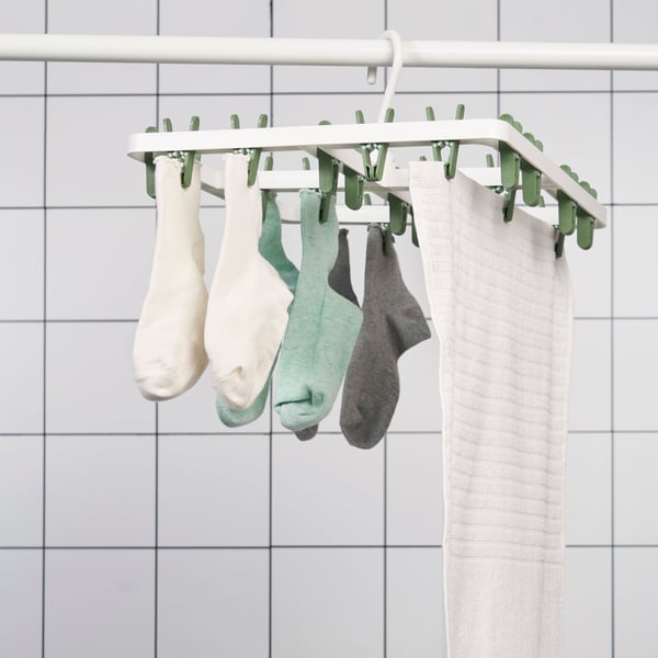 A green SLIBB hang dryer 24 clothes pegs