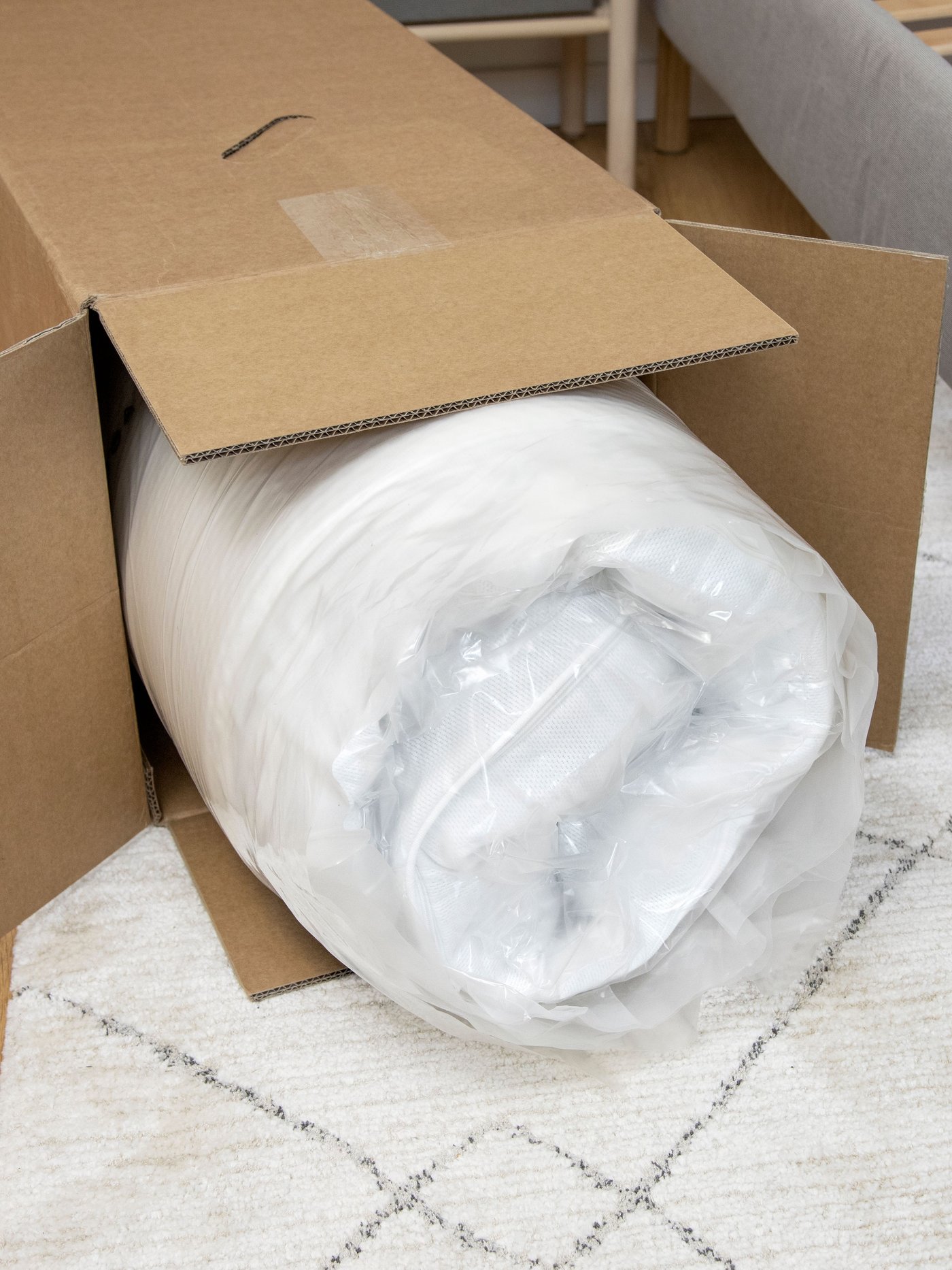 A medium firm/white ÅVABERG foam mattress