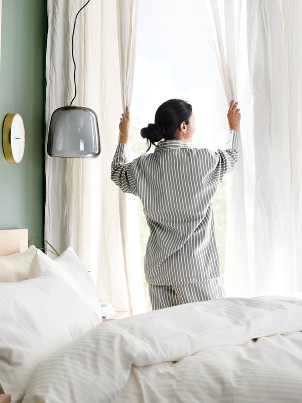 A white AINA curtains, 1 pair in the bedroom