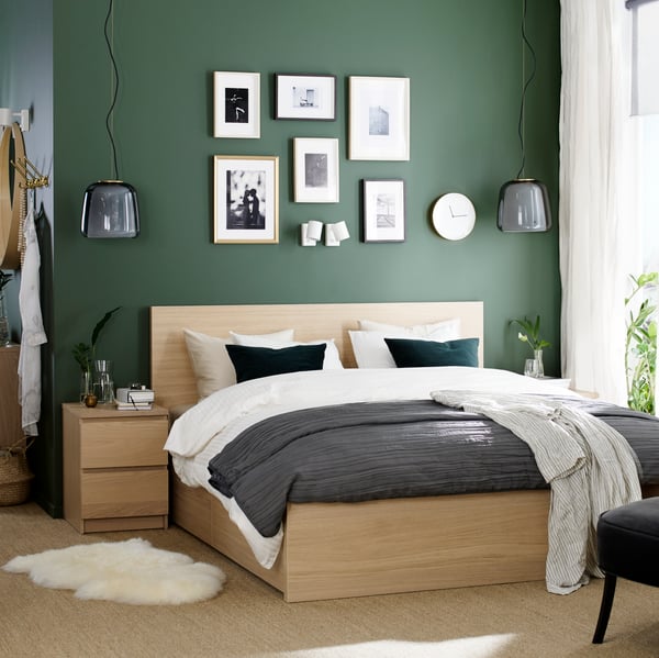 A white stained oak veneer MALM chest of 2 drawers in the bedroom