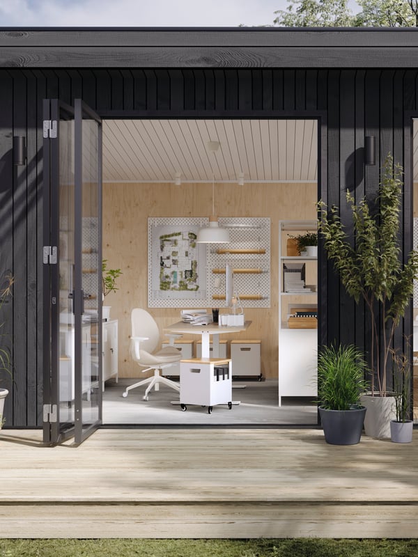 An office with big open door to a patio.