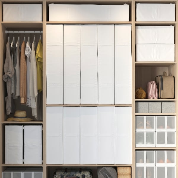 A white SKUBB storage case in the bedroom