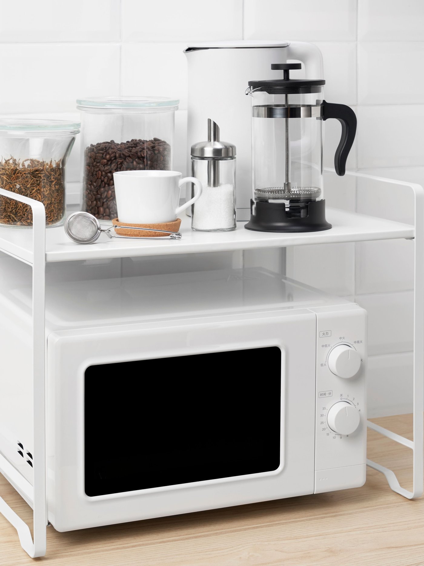 A white AVSTEG kitchen countertop rack