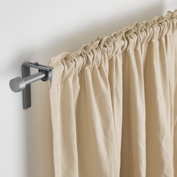One layer of RÄCKA curtain rod mounted on the wall
