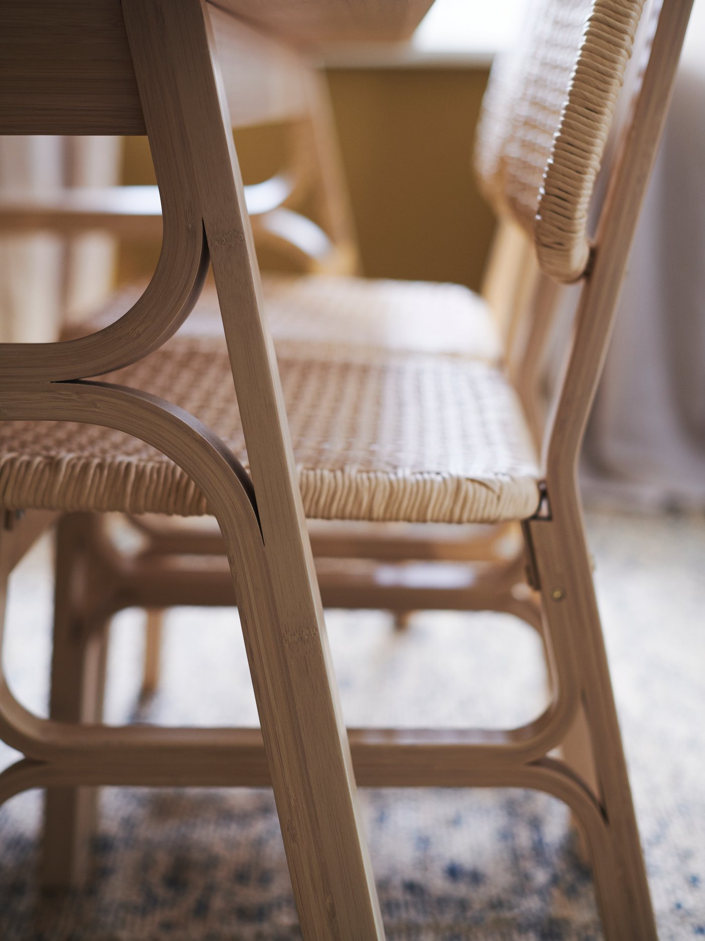VOXLÖV chairs feature beautifully bent bamboo legs, as well as handwoven seats and backrests in paper twine.