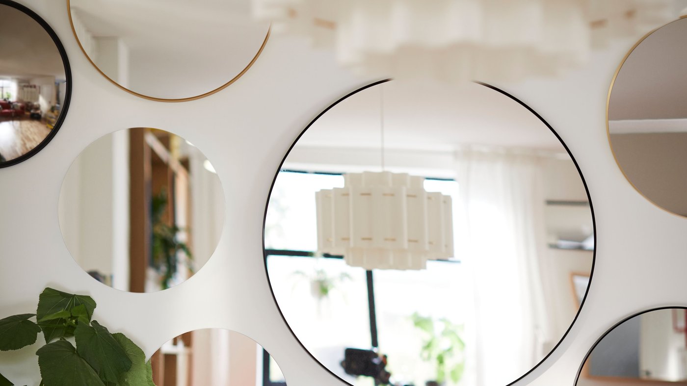 A gold-colour LINDBYN mirror
