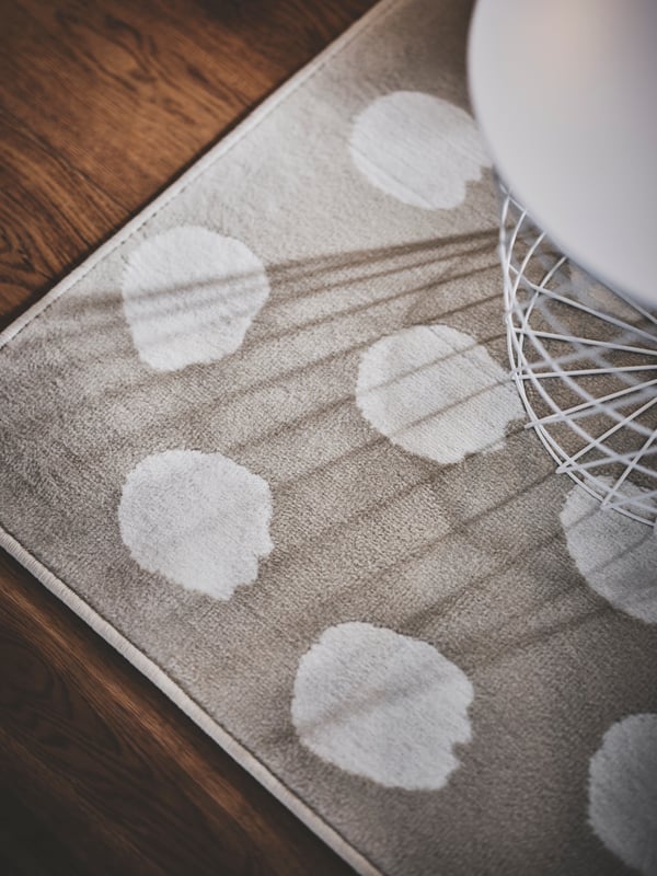 A beige/white dotted BOGENSE rug, low pile