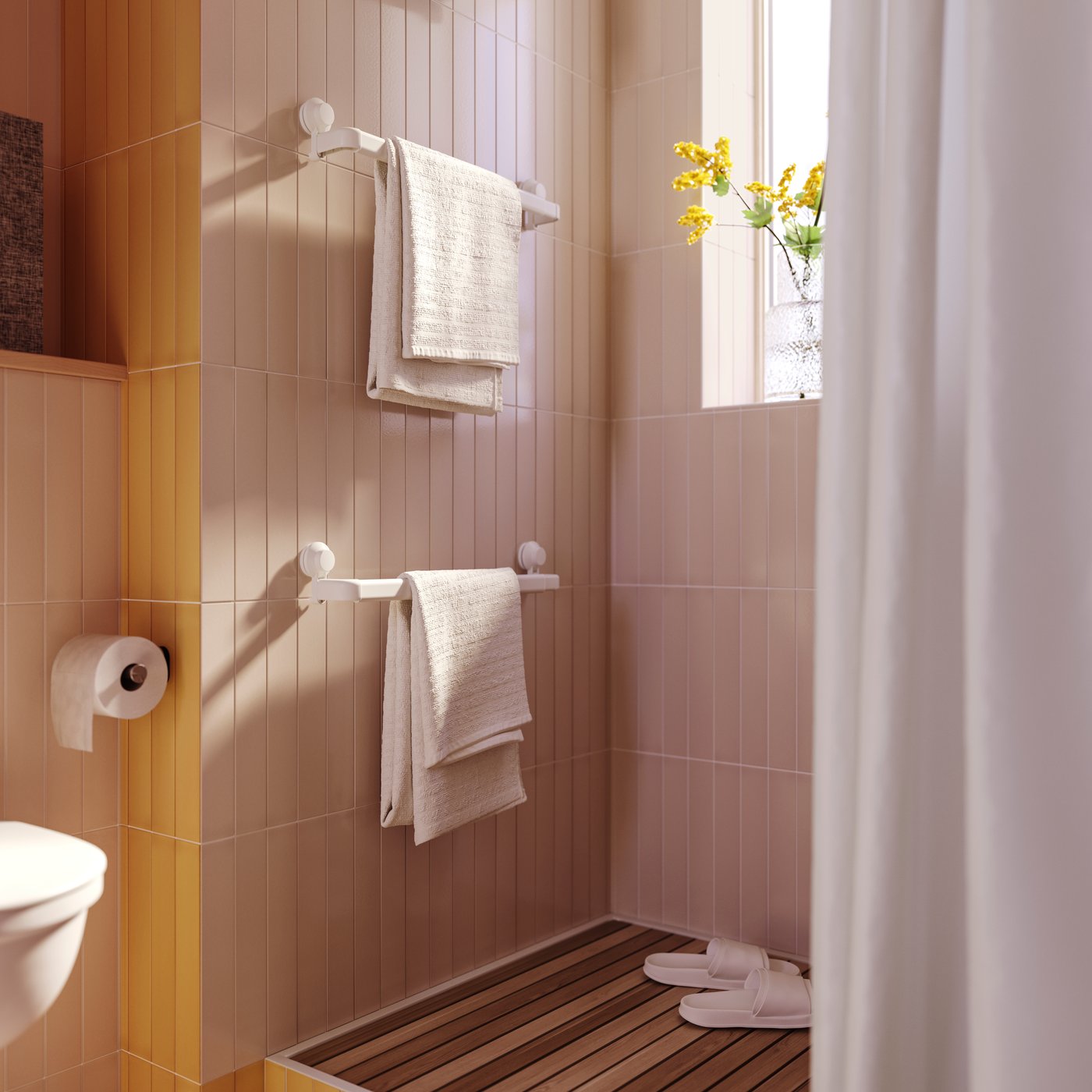 An Orchid/white SMYCKA artificial flower in the bathroom