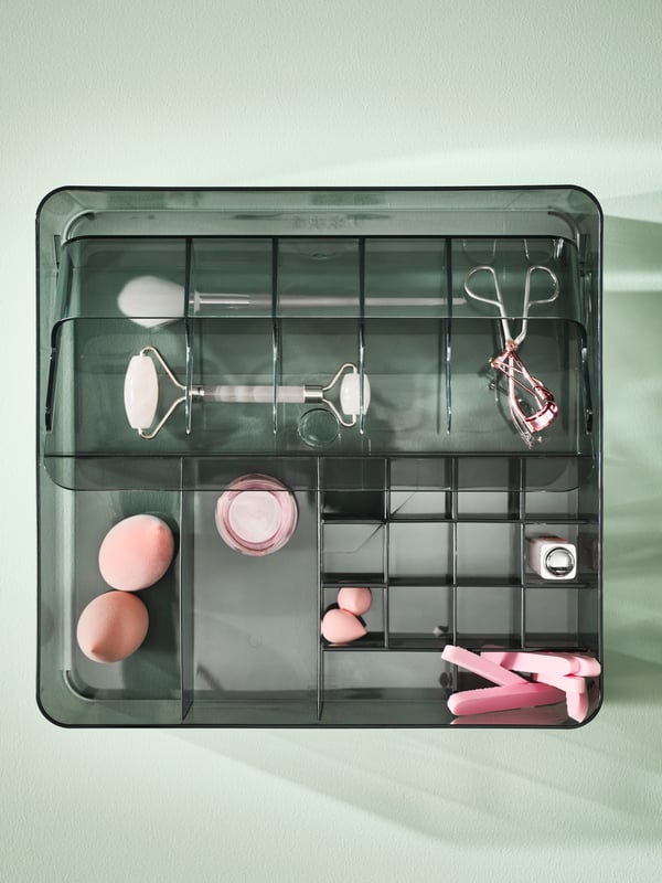 A grey VISSLAÅN box with compartments in the NA