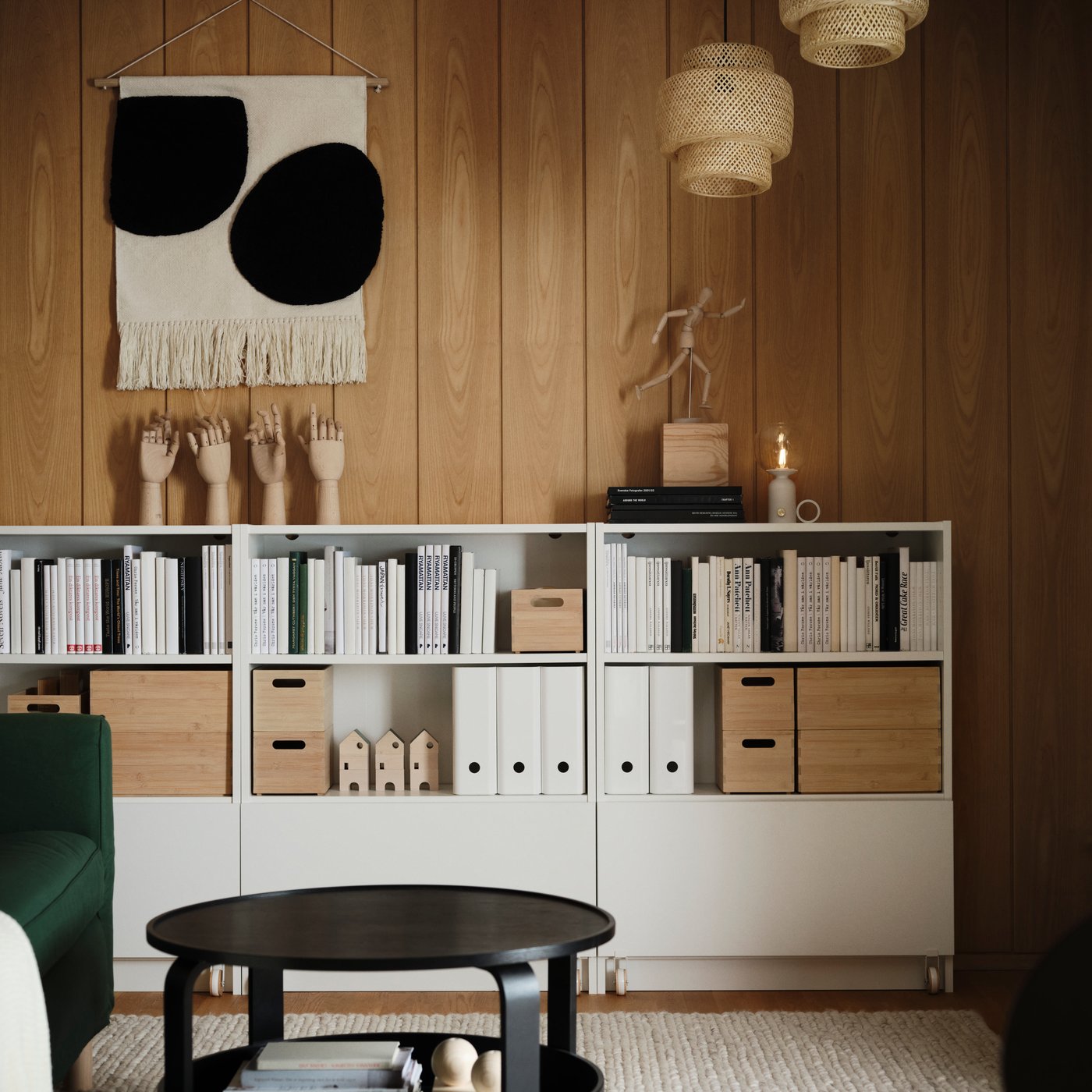 Three white BILLY bookcases with two open shelves each, placed side by side in the living room.