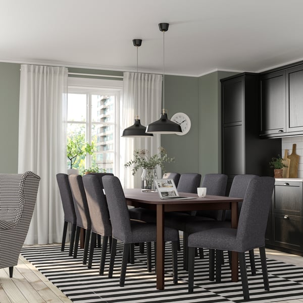 A brown/Gunnared medium grey BERGMUND table and 8 chairs