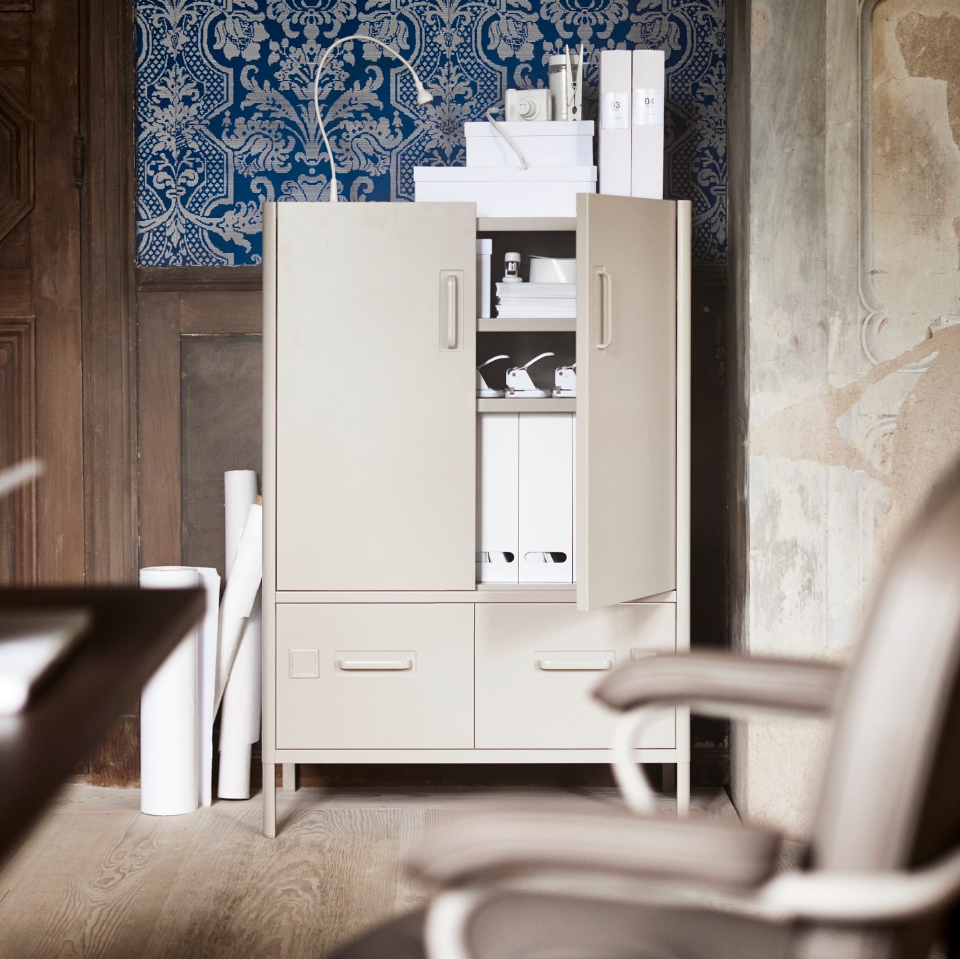 A beige IDÅSEN cabinet with doors and drawers