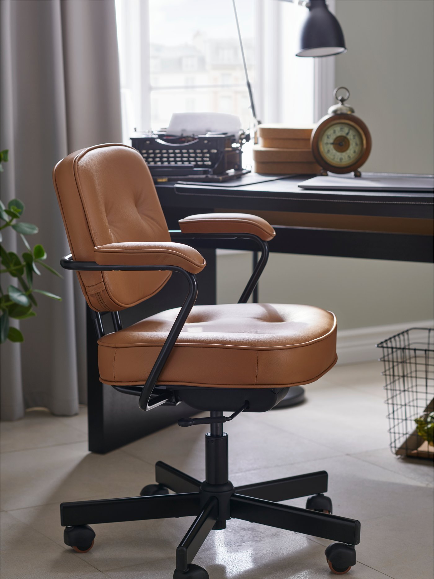 A black-brown MALM desk in the home office