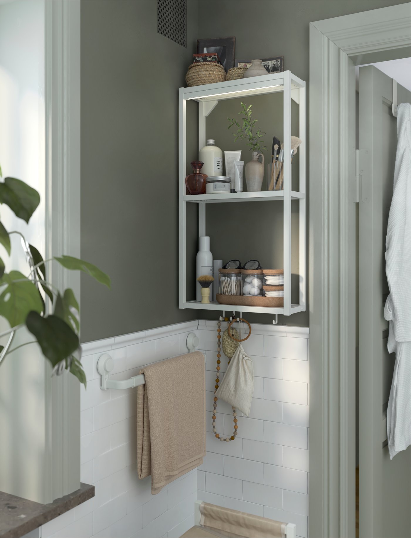 A white ENHET wall frame with shelves in the bathroom