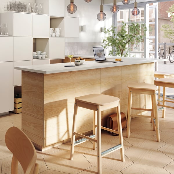 A deks with bar stools in an office. 