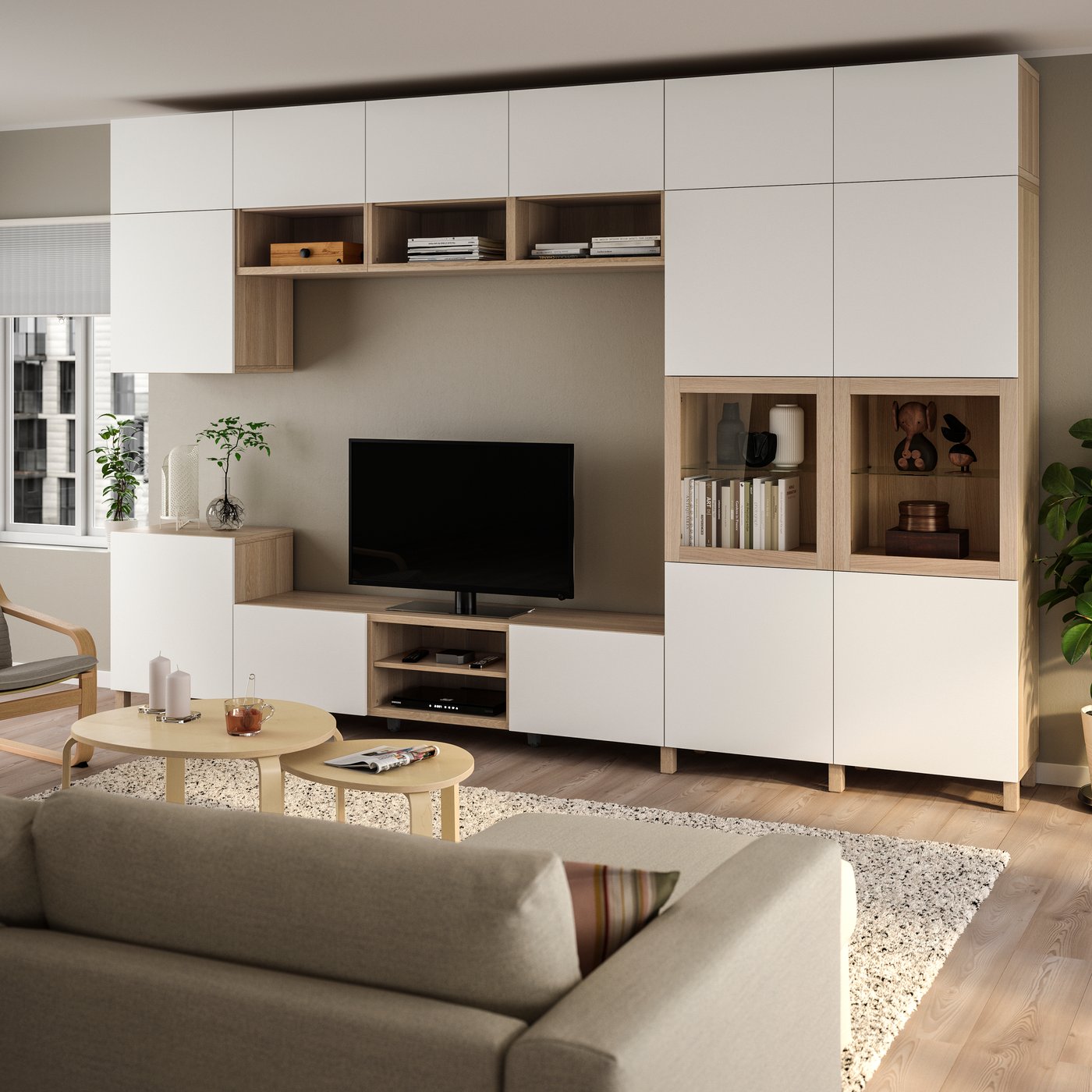 A white stained oak veneer Lappviken/Sindvik clear glass BESTÅ TV storage combination/glass doors in the living room