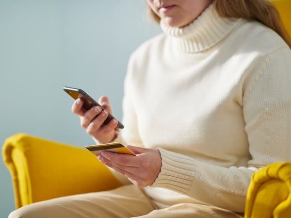 Someone entering payment details via mobile.
